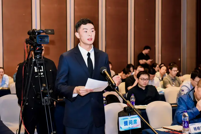 Asking a question during the Q&A session of an academic conference